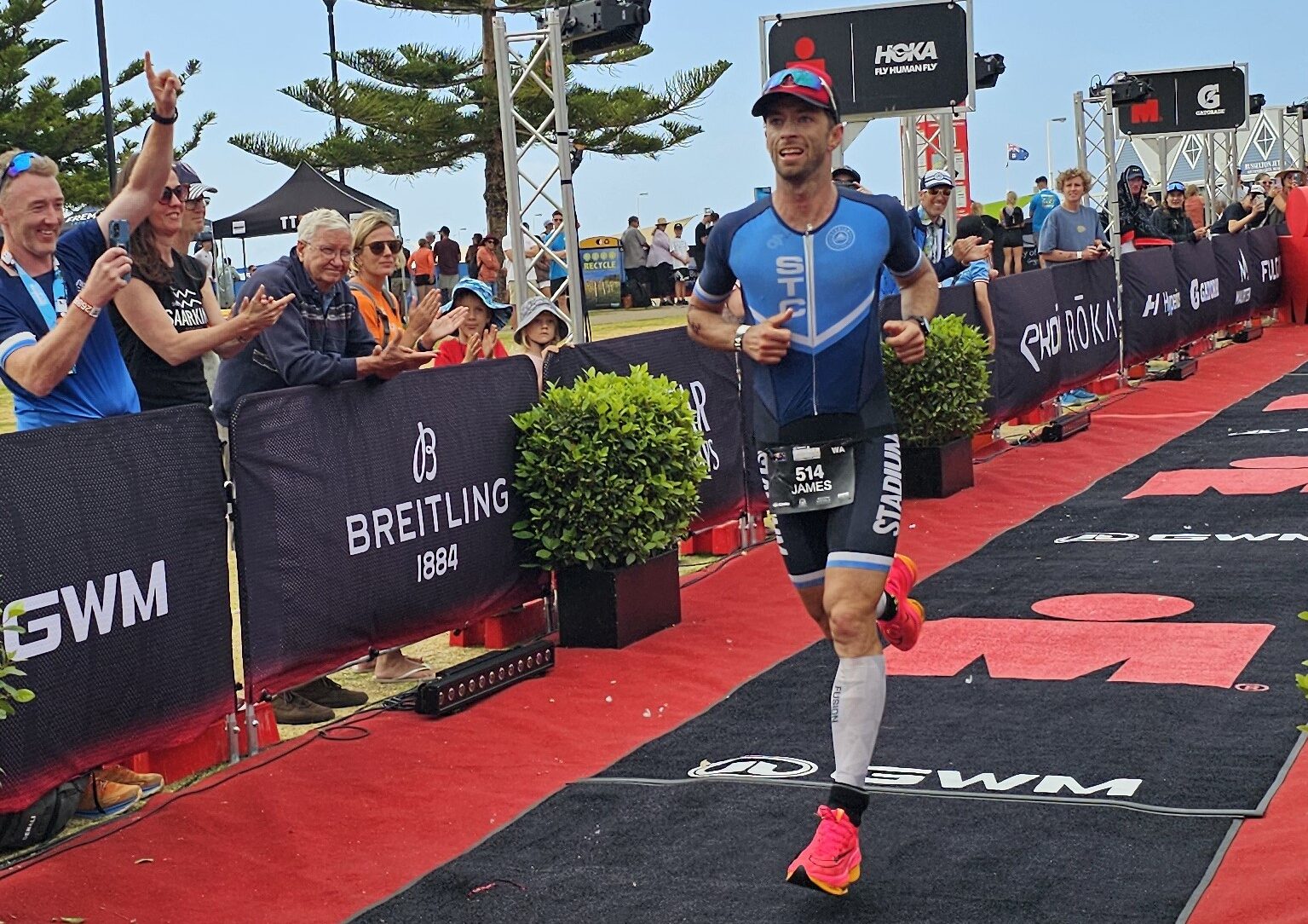 James Lewin completing an Ironman triathlon with expertise in running, cycling and endurance athlete physiotherapy
