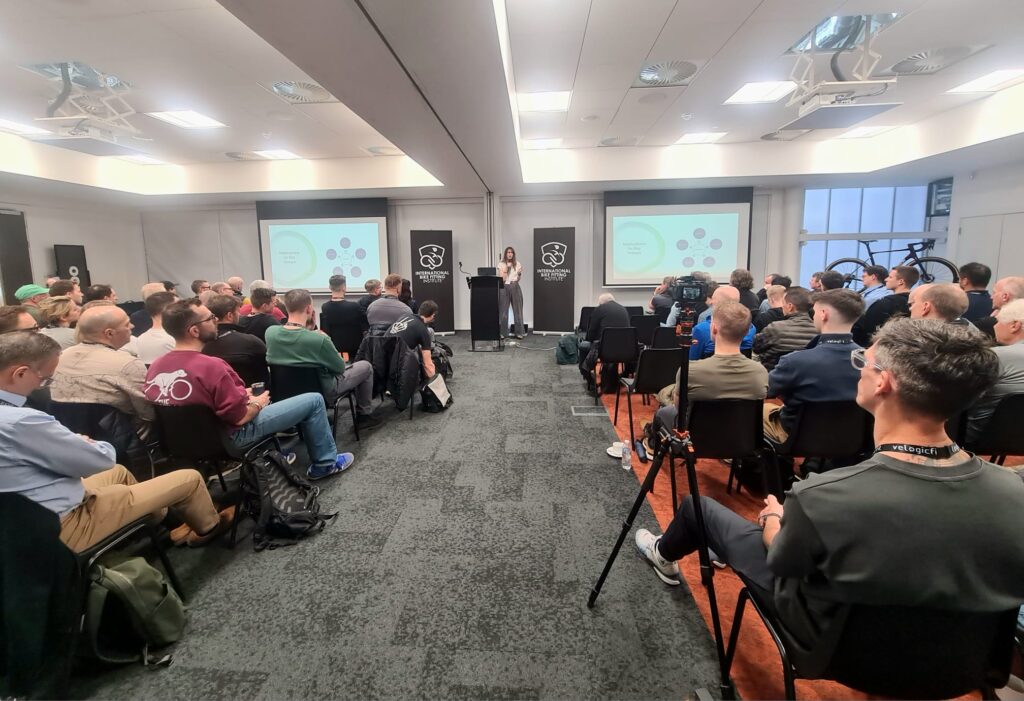 International bike fitters, physiotherapists and cycling professionals attending an education session at the International Bike Fitting Institute Conference in Silverstone UK